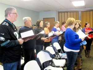 The choir warms up wearing different